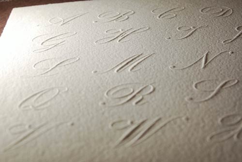 Side view of the relief of our embossed initials